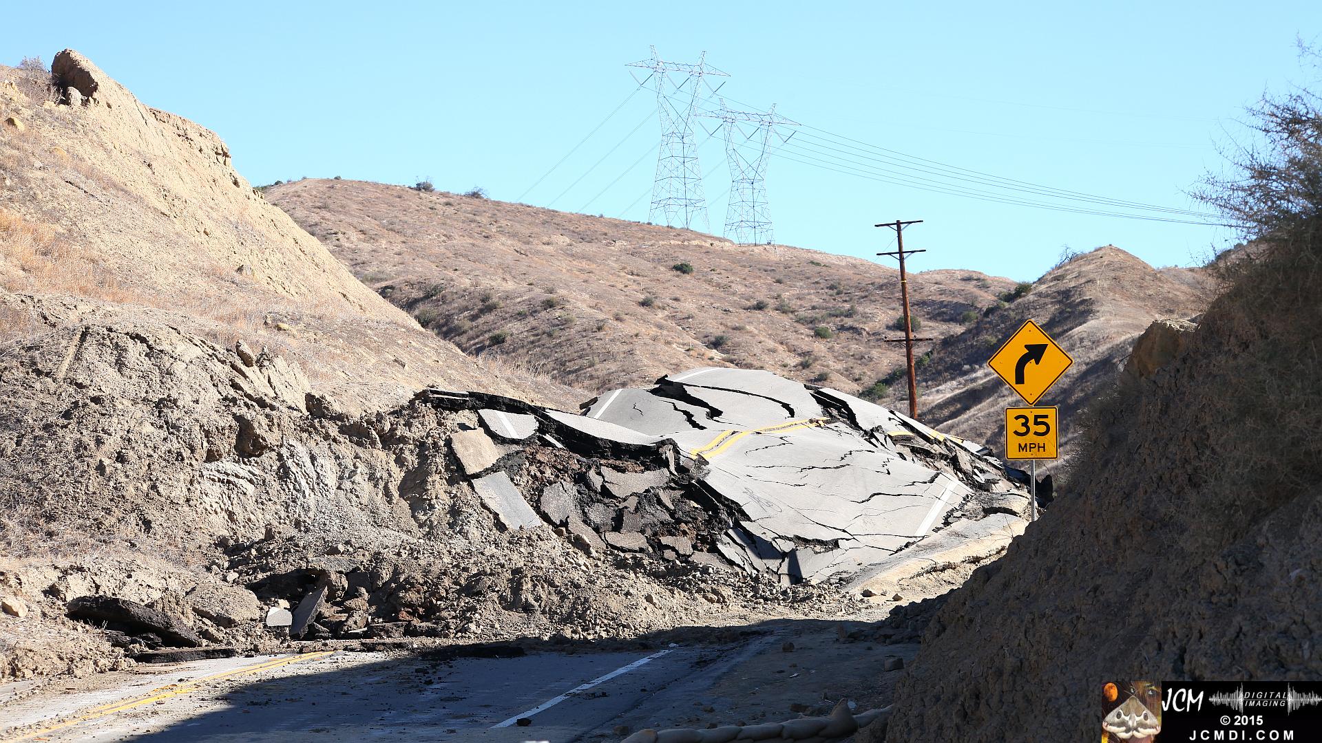 Landslide, buckled pavement, and terrain at Vasquez Canyon Road in Santa Clarita, CA filmed 11-25-2015
